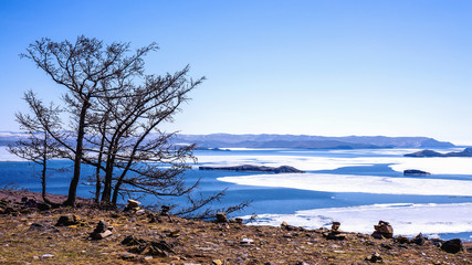  View of the Small Sea Strait and Toynak Island. Far from the right - Olkhon gate strait. On the left is Olkhon Island. Lake Baikal, Russia. April 27th