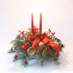  Christmas decoration with red candles and ribbon