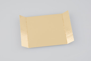 golden cardboard holder for cakes and pastries