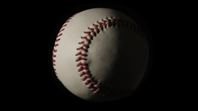 Baseball Spinning Slowly on Black Noir Background