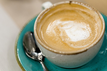Cup of coffee latte art on a table