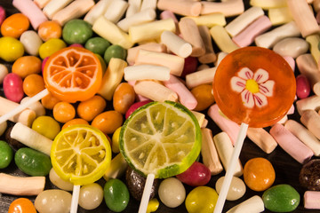 Background of the colorful candies, lollipops and marshmallows