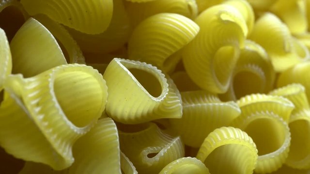 Gomiti rigati dry pasta in rotation.