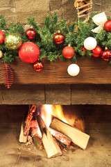 New Year / Christmas tree with colorful festive decorations on the fireplace - 185032263