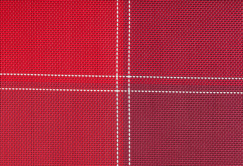 red cloth with white stitching