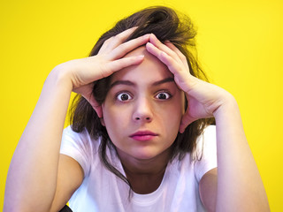 Pretty European young troubled and thoughtful black-haired woman with healthy clean skin, dressed...