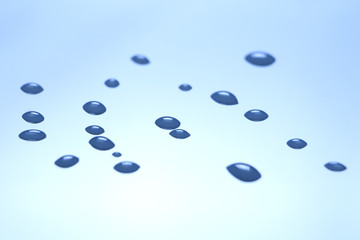 Water droplets on a glossy surface under the corners.