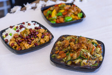 a mixture of Chinese food served on the table