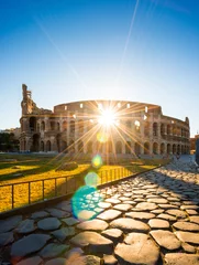 Foto op Canvas Colosseum at sunrise, Rome, Italy, Europe. Rome ancient arena of gladiator fights. Rome Colosseum is the best known landmark of Rome and Italy © Nicola Forenza