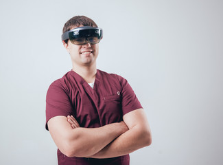 Doctor uses augmented reality goggles.