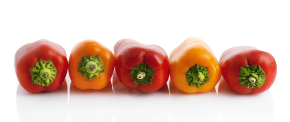 Panorama of peppers isolated on white