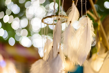 dream catcher with bokeh lights background at night