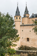 Fototapeta na wymiar The Alcazar of Segovia (Segovia Fortress), a castle, located in Segovia, Spain, a World Heritage Site. Rising out on a rocky crag above the confluence of two rivers near the Guadarrama mountains.