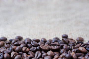Coffee beans on a wooden background, on canvas