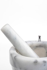 miniature people on a mortar