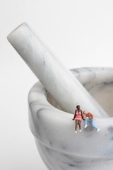miniature people on a mortar