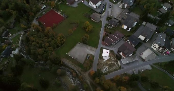 Mountain town, Cinema 4k aerial tilt view over a alpine town, on a sunny autumn day, in blatten,,Valais, in the alps of Switzerland