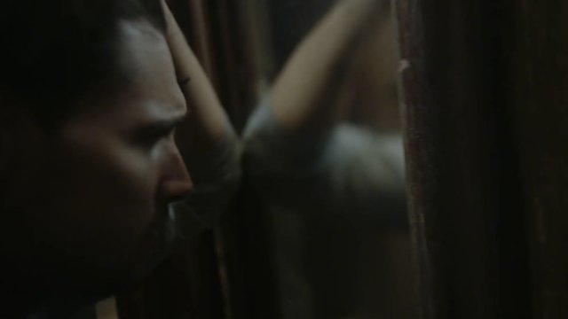 Handsome depressed man at home