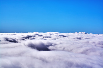 Looking throught the airplane window. Cloud and sky,