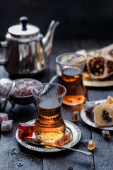 Tea in traditional turkish glasses with oriental delights and sweets