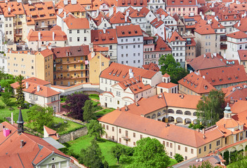 Fototapeta na wymiar An aerial view of Prague with it's red rooftops on a sunny day in the Czech Republic.