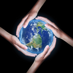 Four hands save the world on black background ,Elements of this image furnished by NASA