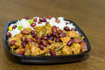 A mixture of Chinese food with rice and peanuts
