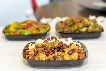 A mixture of Chinese food with rice and peanuts