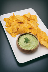 Plate Full Of Corn Chips And Guacamole (Avocado Sauce)