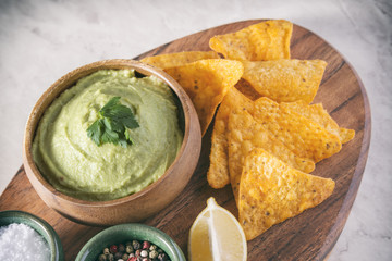 Arrangement Of Nachos (Corn Chips) And Guacamole (Avocado Sauce)