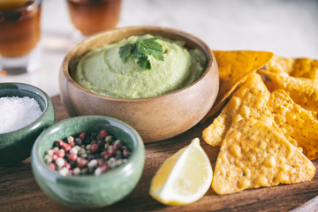 Arrangement Of Nachos (Corn Chips) And Guacamole (Avocado Sauce)