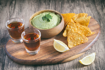 Arrangement Of Nachos (Corn Chips) And Guacamole (Avocado Sauce)