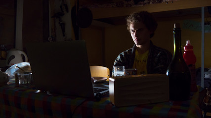 lonely man sitting in the dark room