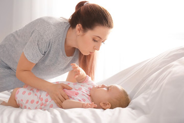 Cute little baby with mother at home