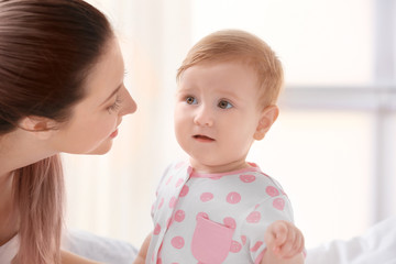 Cute little baby with mother at home