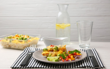 Plate of tasty baked Brussels sprouts with cheese on table