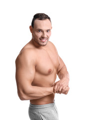 Fototapeta premium Muscular young bodybuilder on white background