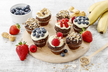 Muffins decorated with fresh fruits. Healthy snack.
