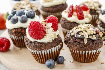 Muffins decorated with fresh fruits. Healthy snack.