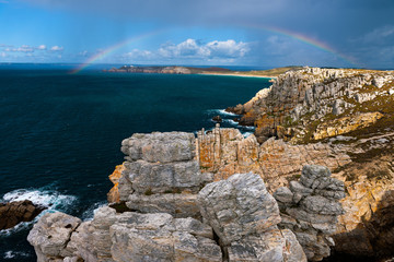 Fototapeta na wymiar Rainbow over Pointe du Toulinguet