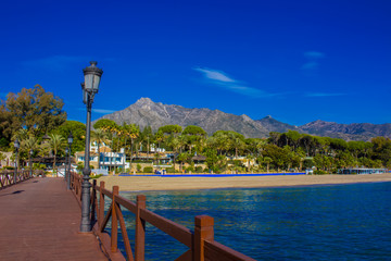 Pier. Wooden pier in Marbella. Malaga province, Costa del Sol, Andalusia, Spain. Picture taken – 14 december 2017.