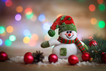 Christmas card. toy snowman on Christmas background.
