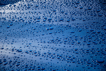 raindrops on a blue car