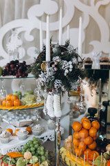 The wedding buffet is decorated in the winter theme.