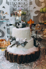 The wedding buffet is decorated in the winter theme.