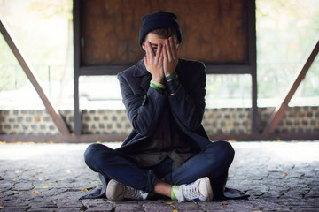 Teen covered his face, peeking through his fingers at street
