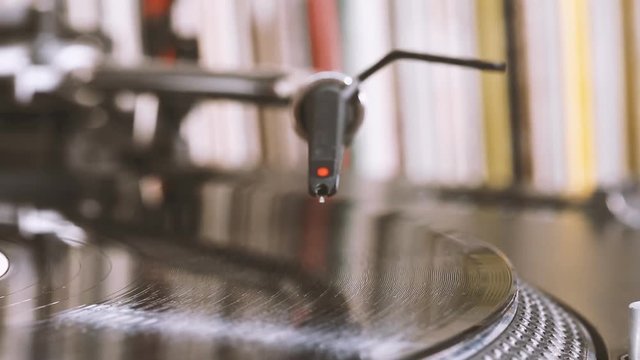 DJ headshell on spinning turntable. Listening the music