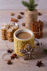 Mug of hot cocoa, good image to convey a feeling of winter and warmth. Winter drink - hot chocolate with cinnamon and anise on wooden background. Coffee with milk
