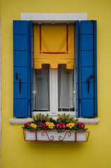 Fototapeta na wymiar Yellow and Blue Window in Burano