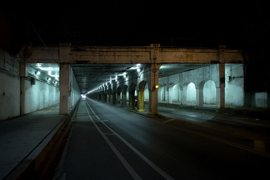 Dark Chicago City Alley Industrial Train Bridge Underpass At Night.